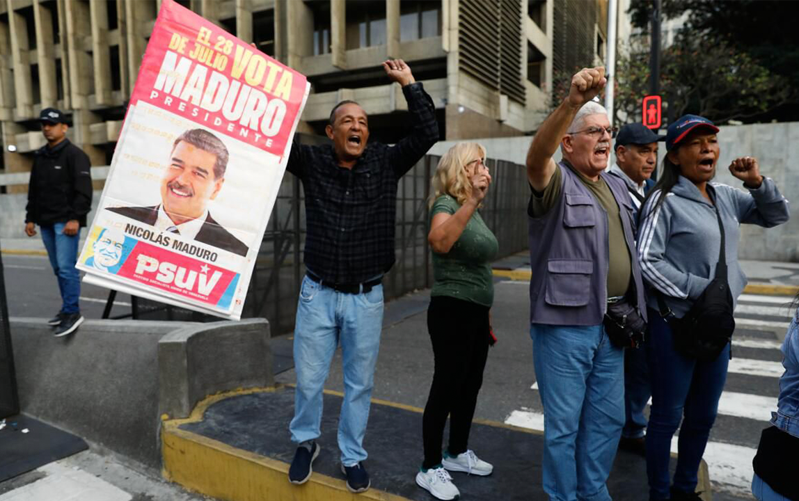 People protesting in the streets of Venezuela following U.S. military strikes and political developments