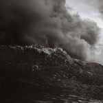 Dark storm clouds over rough sea during severe weather conditions