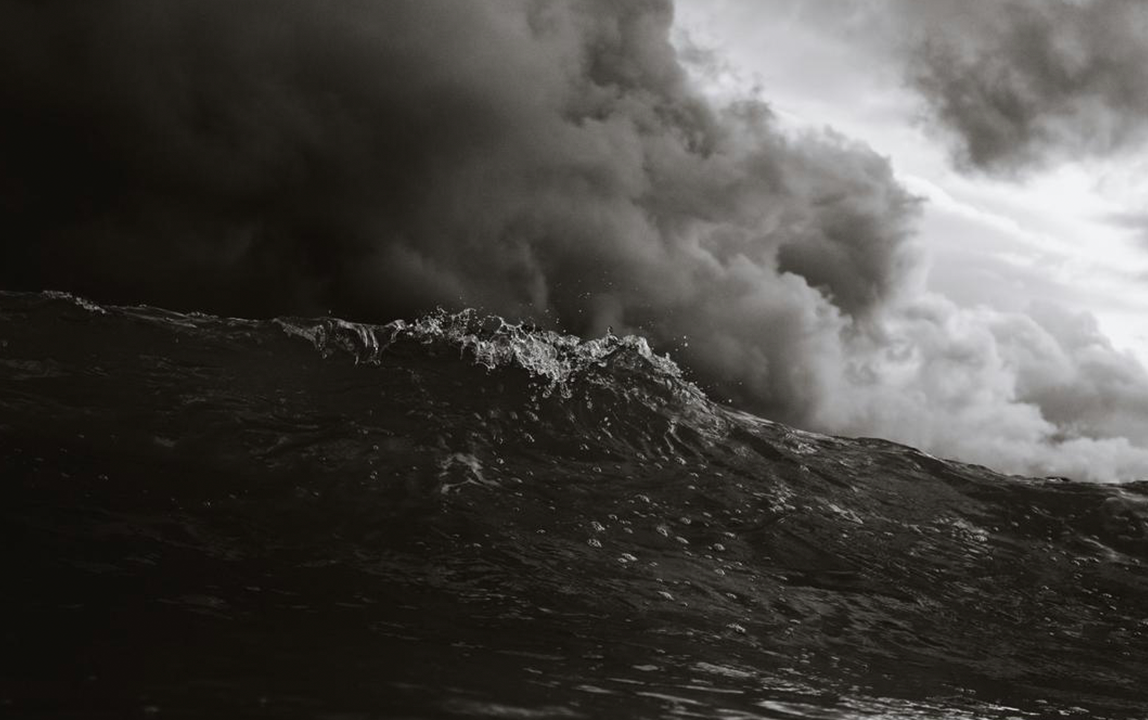 Dark storm clouds over rough sea during severe weather conditions