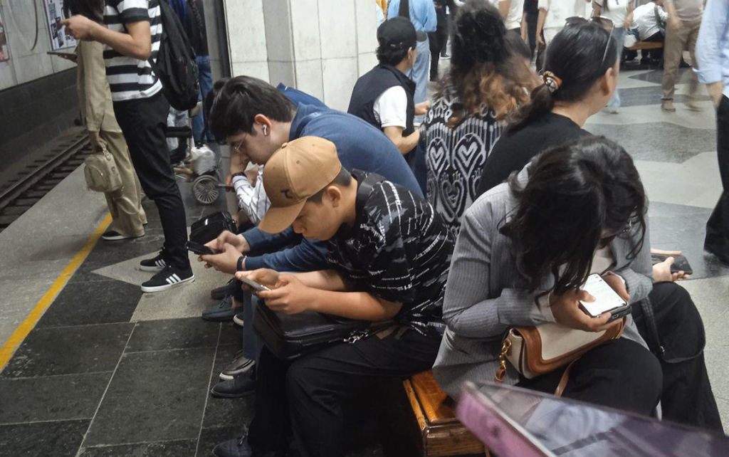 Everyone on the subway is looking at their phones.