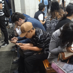 Everyone on the subway is looking at their phones.