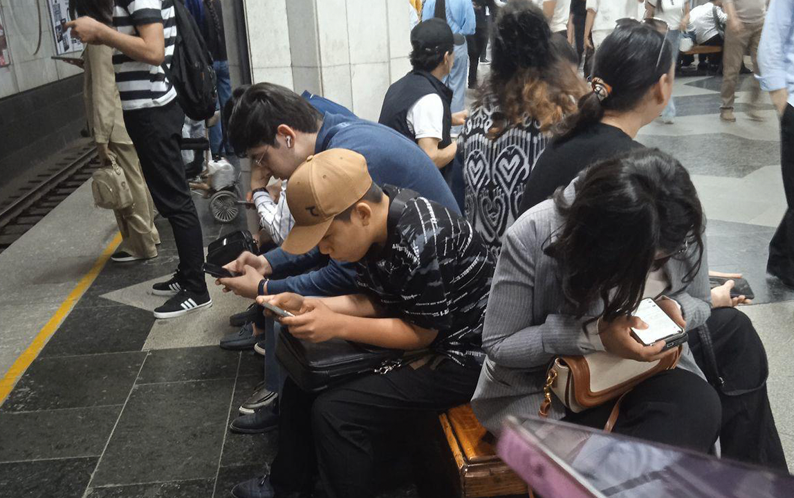 Everyone on the subway is looking at their phones.